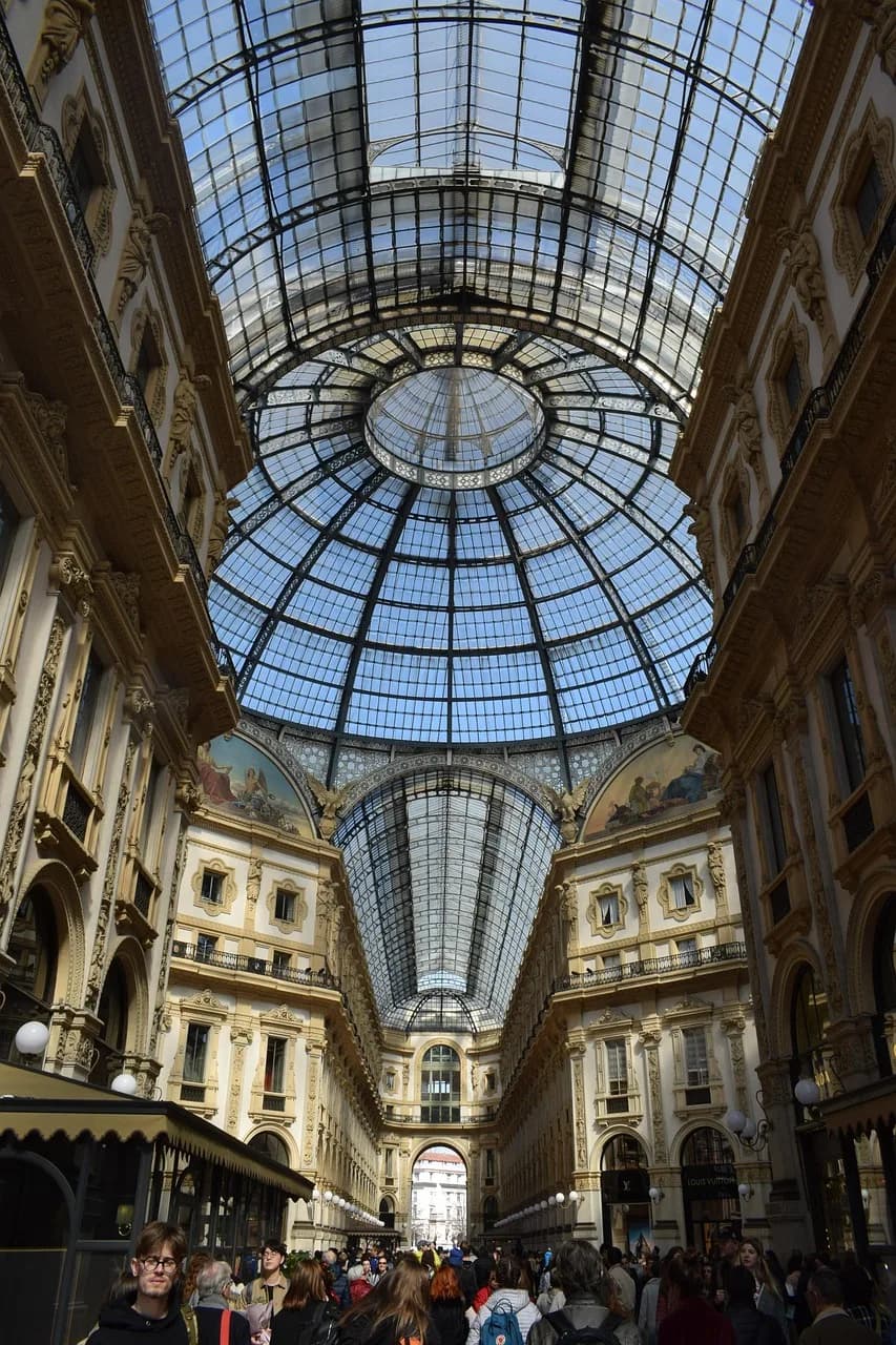 The glass dome and ornate arcades of the Galleria Vittorio Emanuele II in Milan.